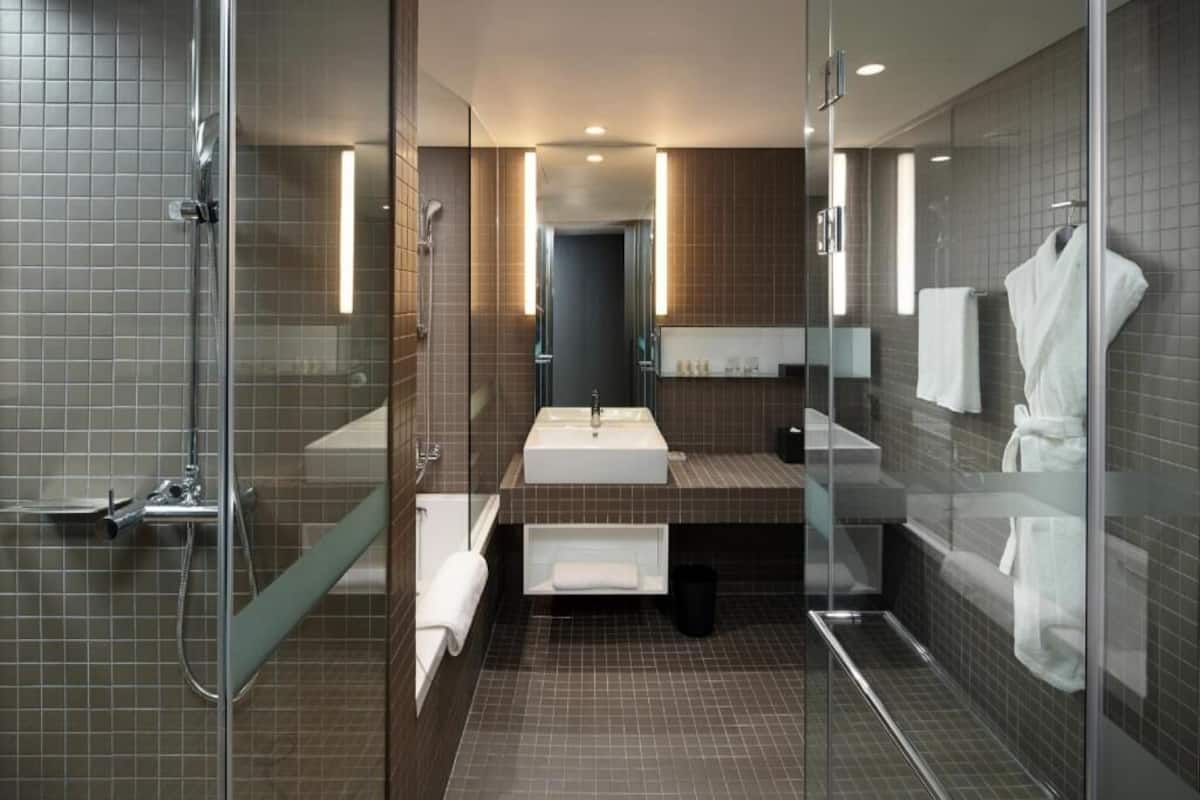 Bathroom | Deep-soaking bathtub, designer toiletries, hair dryer, bathrobes