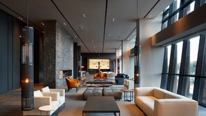 A spacious living area with modern furniture, large windows, and a fireplace. - Shilla Stay Busan Haeundae (Busan)