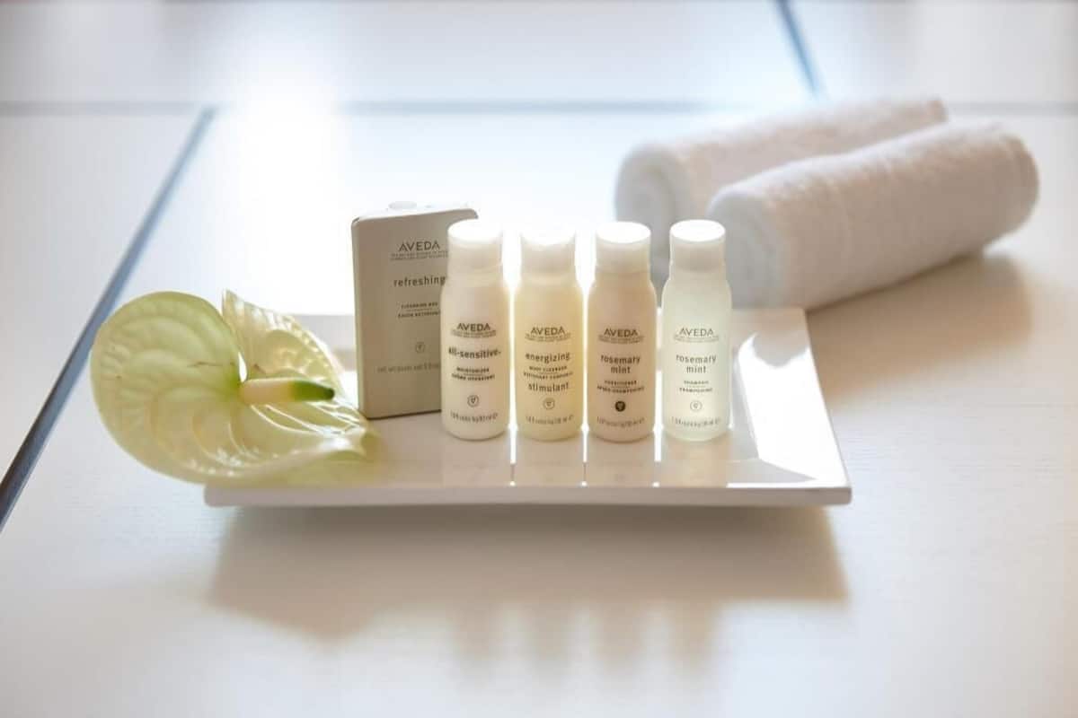 Bathroom amenities | Deep-soaking bathtub, designer toiletries, hair dryer, bathrobes