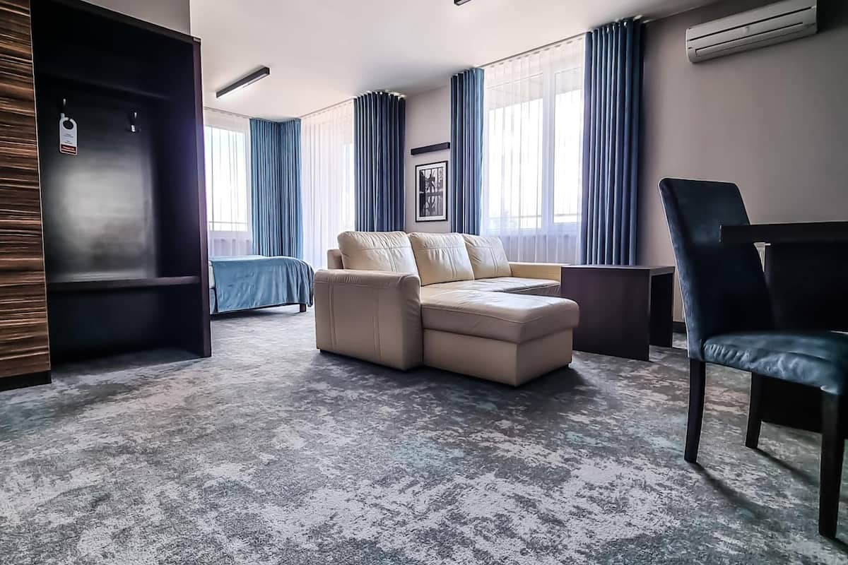 junior suite, lake view | 1 bedroom, premium bedding, desk, iron/ironing board