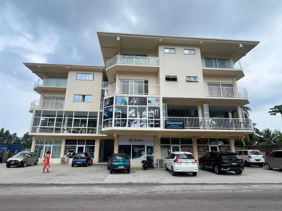 A multi-story building with a ground floor featuring a sports bar and restaurant.