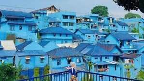 A densely packed residential area with houses painted in a uniform blue color. - Sierra Villa Malang (Malang)