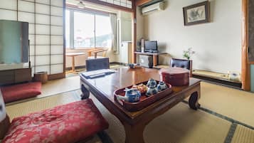 Japanese Style with Private Bath, River View | Living area | Flat-screen TV