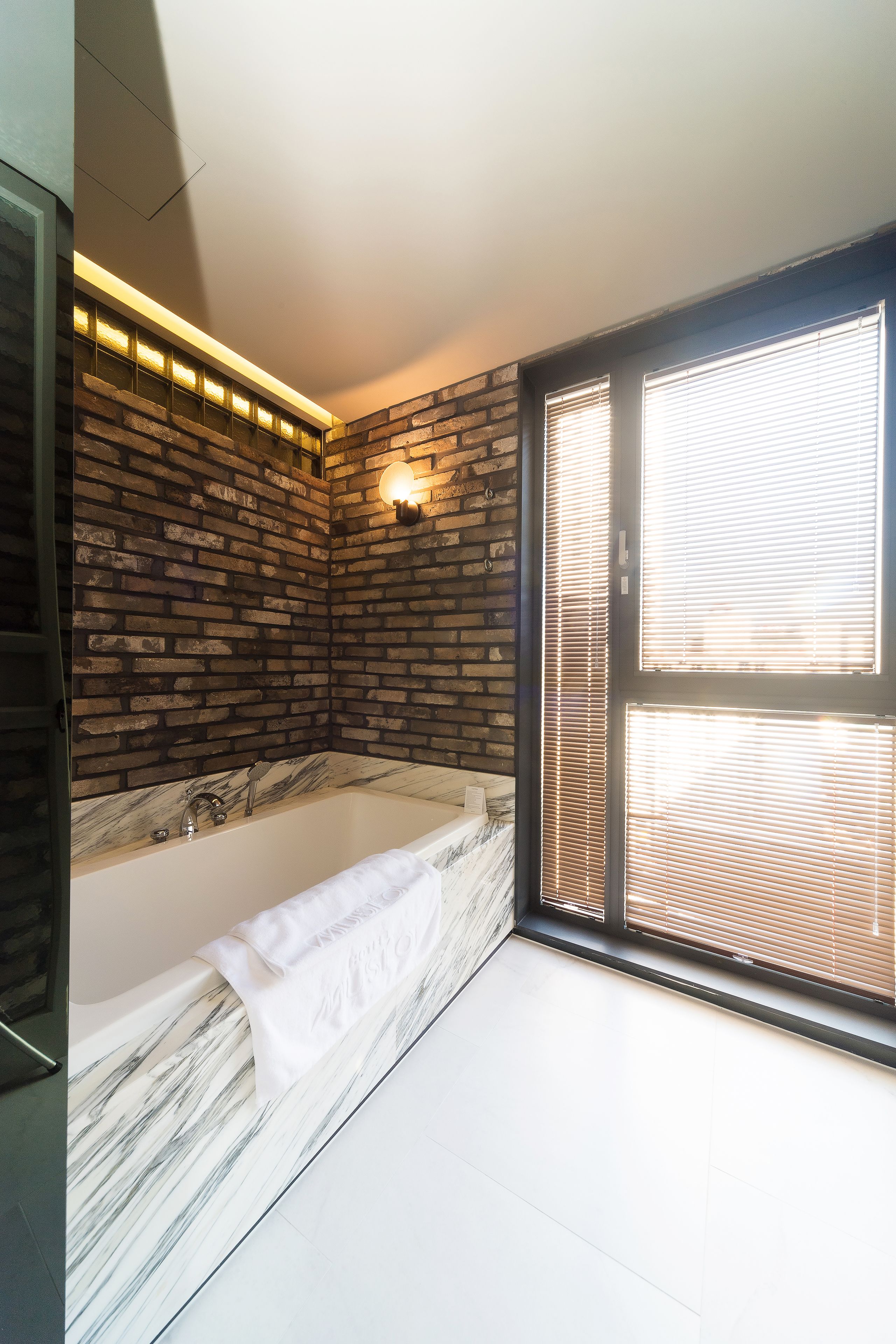 deluxe room | bathroom | hair dryer, bathrobes, slippers, bidet