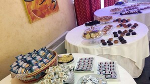 A buffet table with various food items and packaged snacks. - Zaiera Resort Club (Solarino)