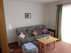 Basic Apartment, 1 Bedroom, Non Smoking, Mountain View | Living area | Flat-screen TV