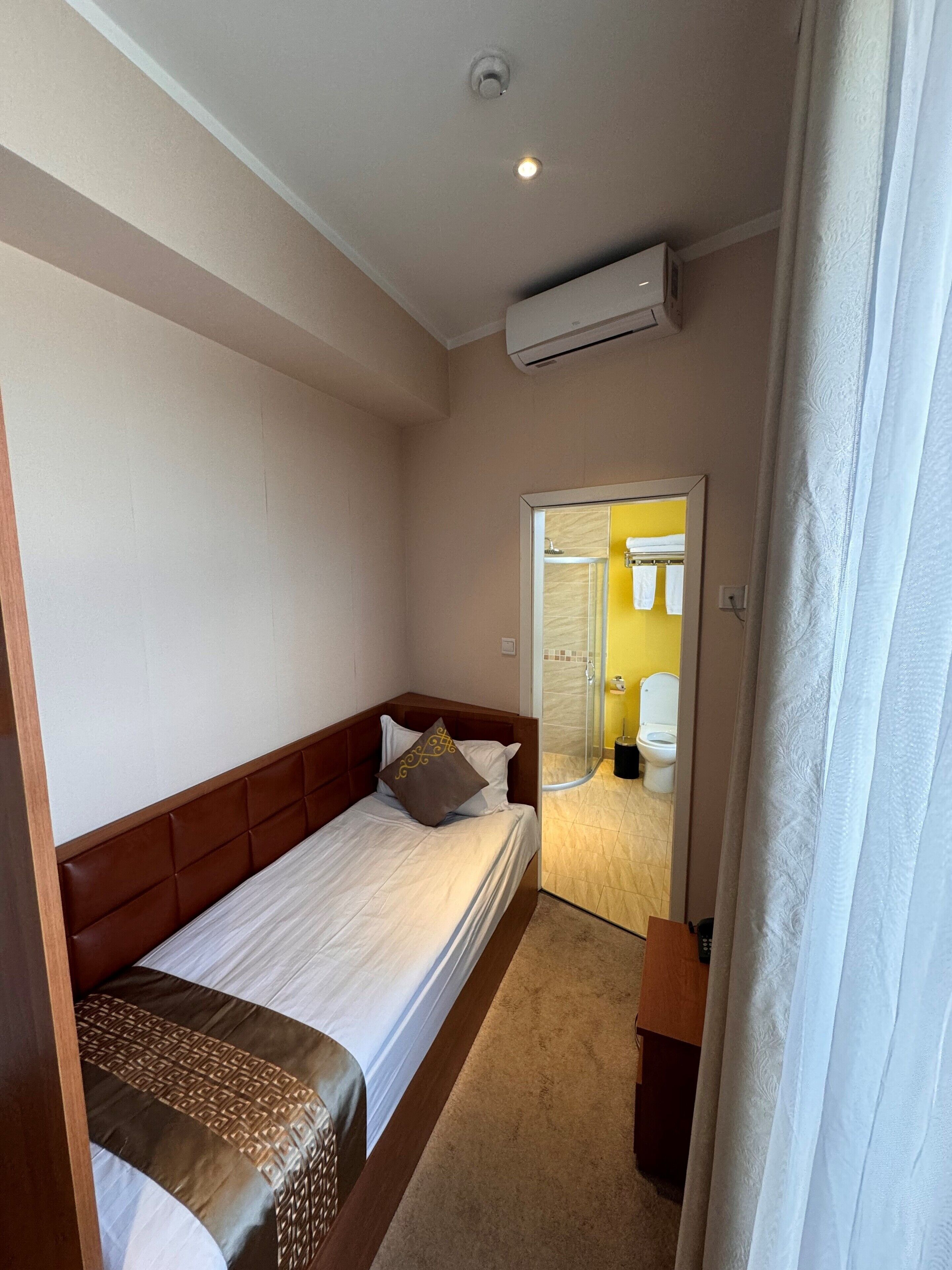 economy room, 1 bedroom, non smoking, city view | minibar, in-room safe, blackout curtains, soundproofing