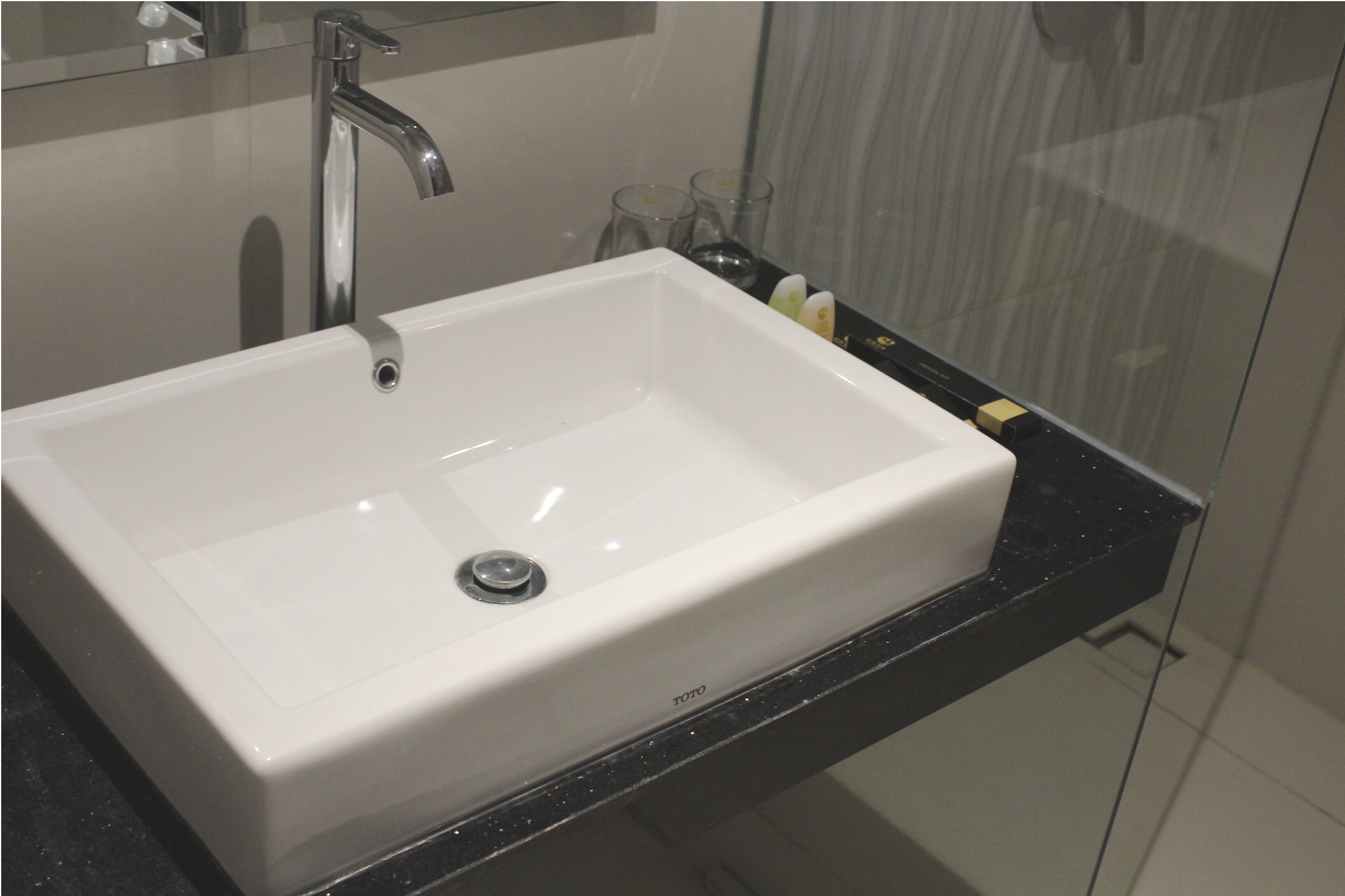 deluxe room | bathroom | shower, free toiletries, hair dryer, slippers