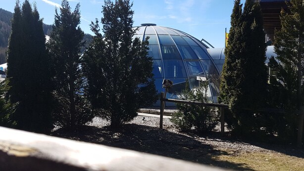 A modern building with a dome structure surrounded by trees. - Weigl Hütte (Semmering)