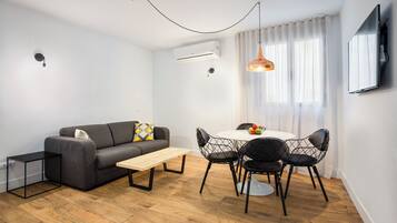 Deluxe-Apartment, 1 Schlafzimmer | Wohnbereich