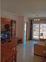 Apartment, 2 Bedrooms, Sea View (Frontales) | Living area | 32-inch TV with digital channels