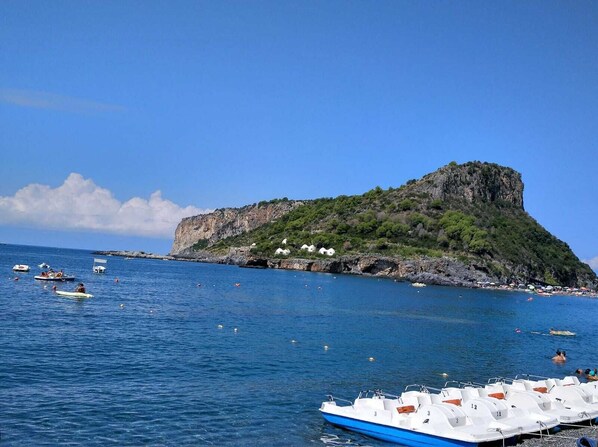 Private beach nearby, black sand
