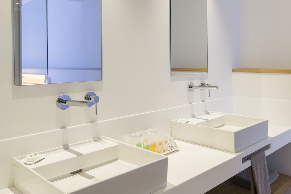 superior double room | bathroom | rainfall showerhead, free toiletries, hair dryer, towels