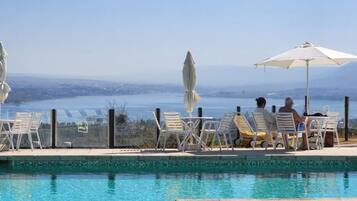 3 outdoor pools, open 9:00 AM to 9:00 PM, pool umbrellas, pool loungers