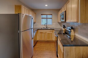 Fridge, microwave, stovetop, coffee/tea maker