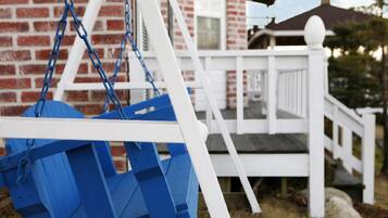 Relax on the porch with a swing set and enjoy the peaceful surroundings.