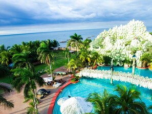 Outdoor pool, open 6:00 AM to 10:00 PM, pool umbrellas - Tanza Oasis Hotel and Resort (Tanza)