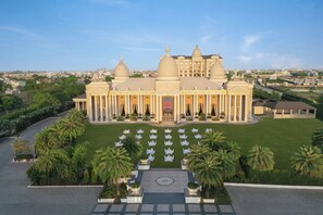 A grand building with a symmetrical facade, large domes, and a central entrance. - Sheraton Grand Palace Indore (Indore)