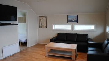 Appartement, 2 chambres, vue mer | Coin séjour | Télévision à écran plat