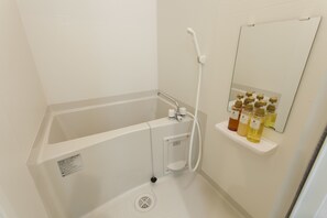 Separate tub and shower, free toiletries, hair dryer, slippers