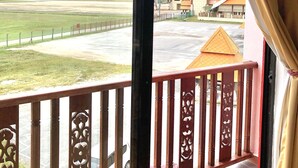 A balcony with a view of a sports field and buildings. -  AM Transit Inn Kuala Terengganu (Kuala Terengganu)