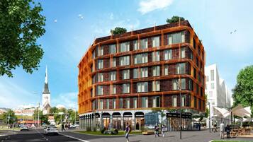 A multi-story building with a brick facade and large windows.
