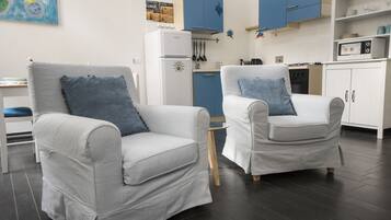 Apartment, 1 Bedroom | Living area | Flat-screen TV