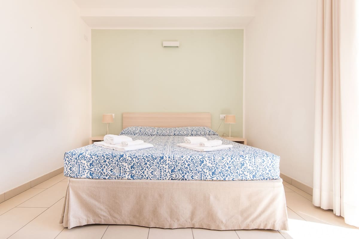 Apartment, 1 Bedroom, Sea View | Premium bedding, in-room safe, soundproofing, iron/ironing board