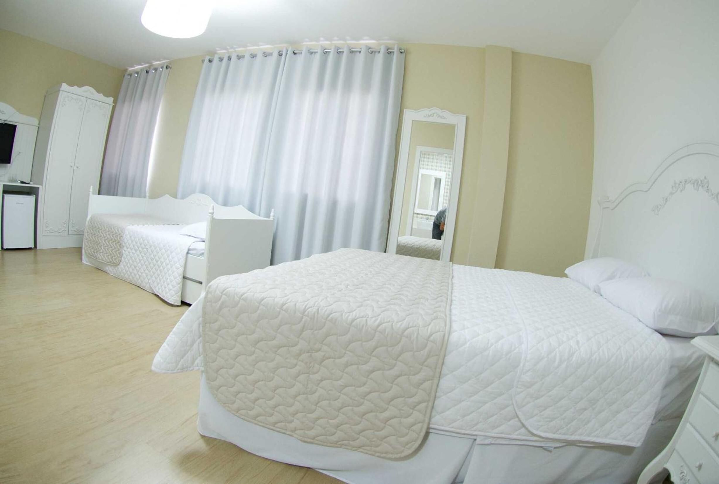 minibar, desk, blackout curtains, iron/ironing board