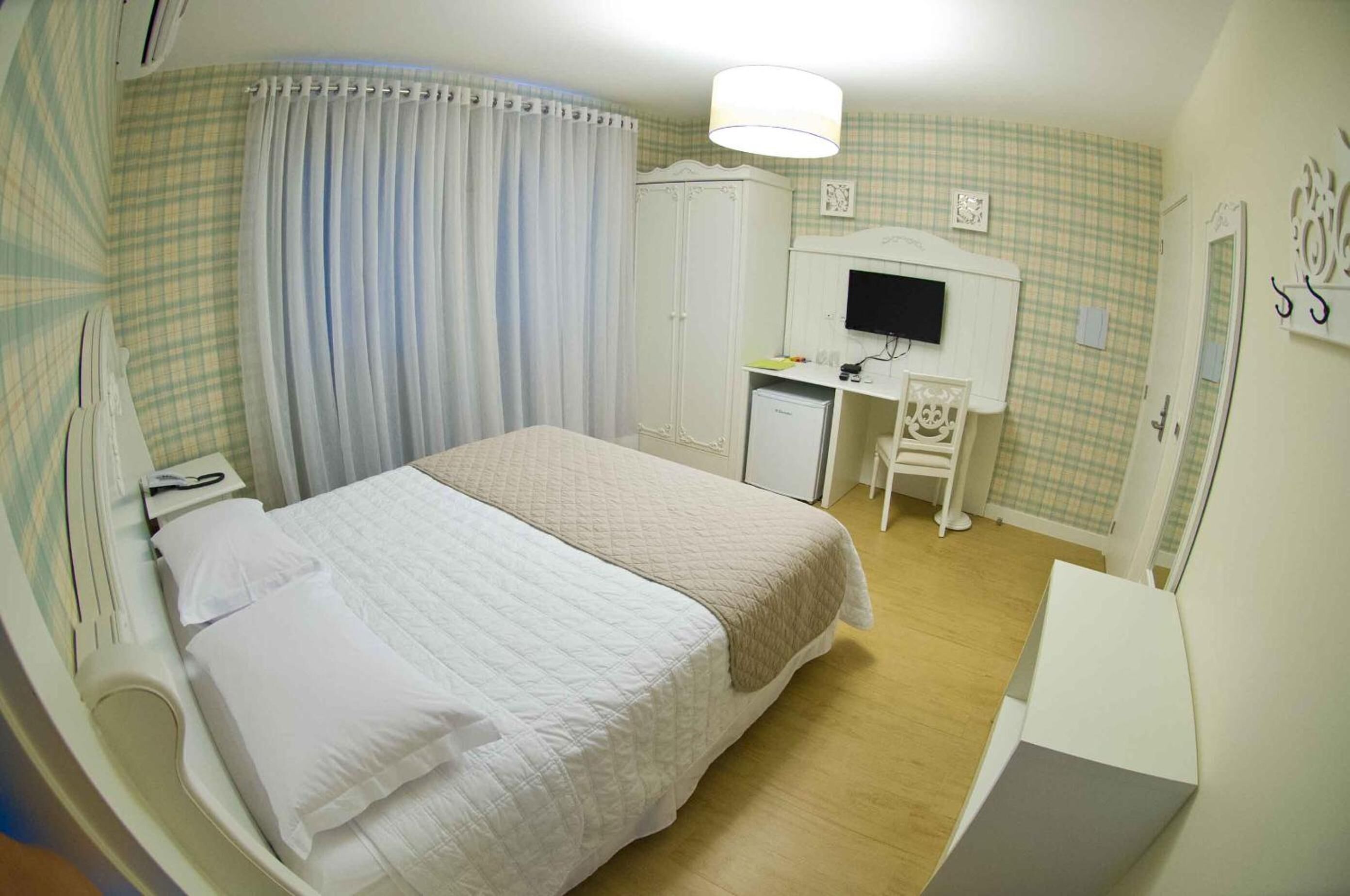 minibar, desk, blackout curtains, iron/ironing board