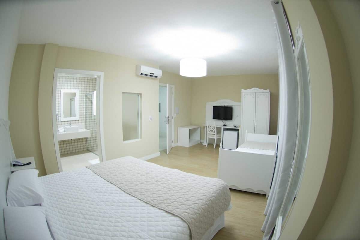 deluxe room | minibar, desk, blackout curtains, iron/ironing board