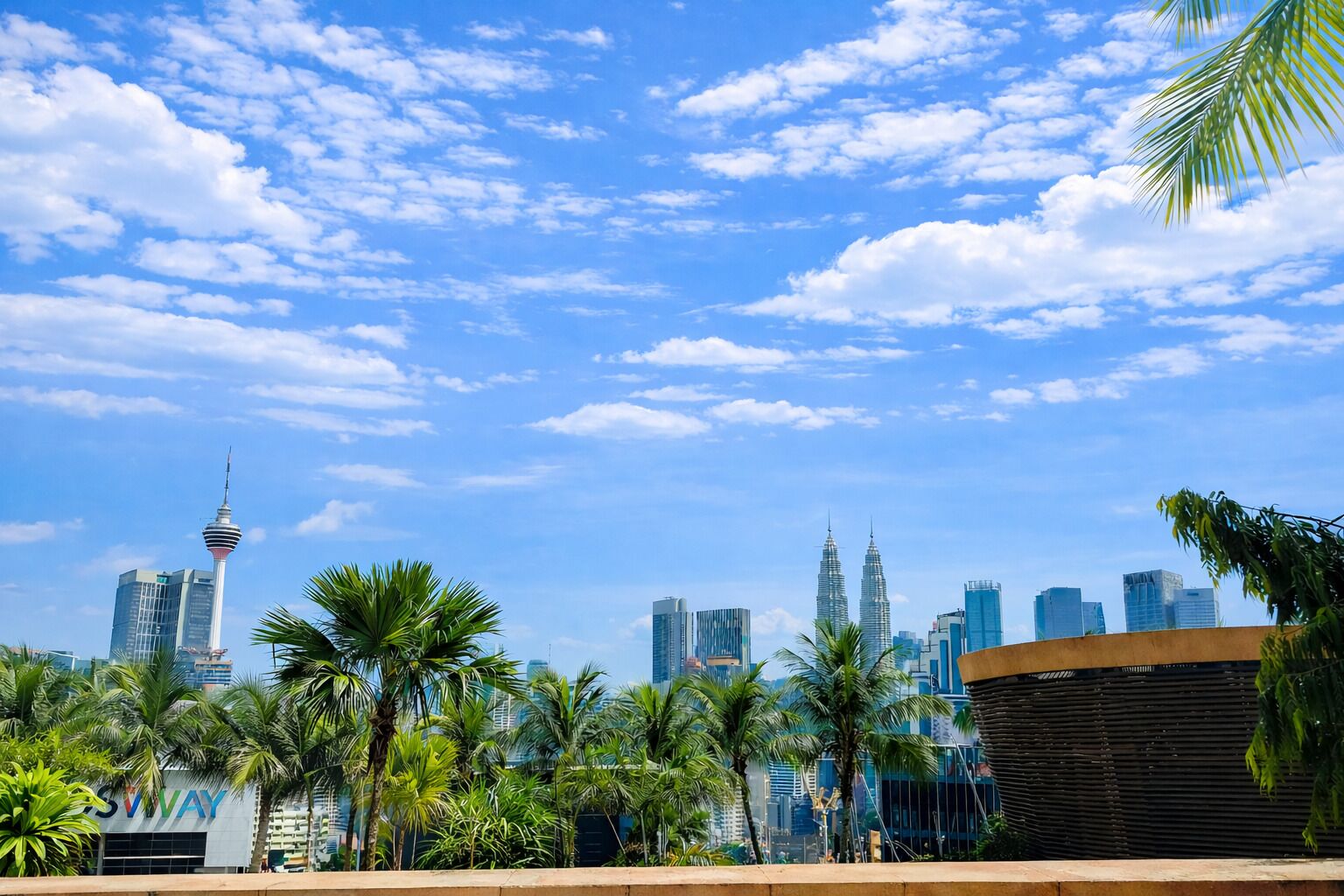 A city skyline with prominent skyscrapers, including a tower with a distinctive design.