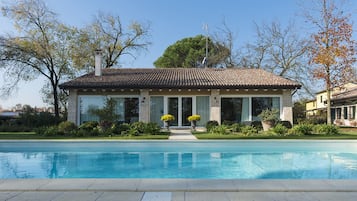 Seasonal outdoor pool, pool loungers
