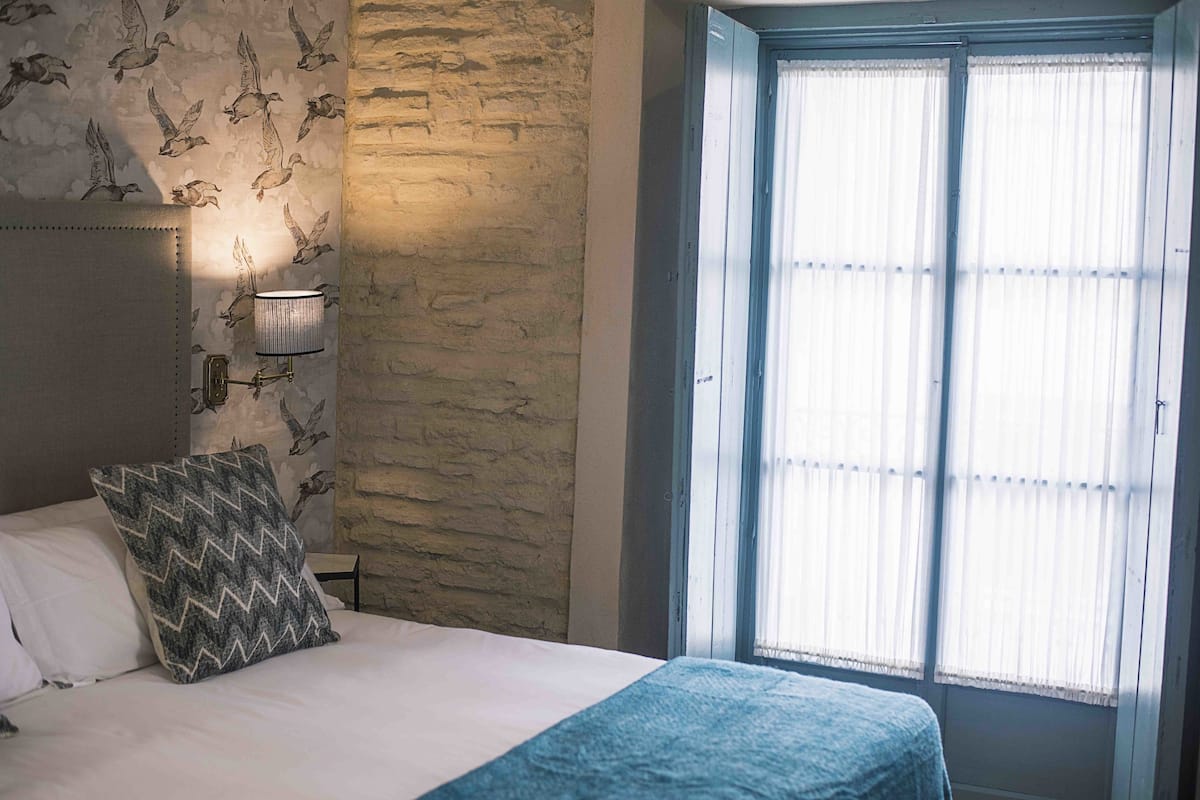Deluxe Double Room, Balcony | Blackout curtains, iron/ironing board (on request), free WiFi