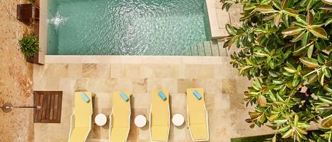 Outdoor pool, open 11:00 AM to 7:00 PM, pool loungers