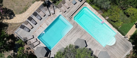 2 outdoor pools, open 8:00 AM to 8:00 PM, pool umbrellas, sun loungers