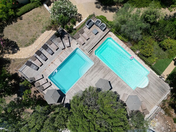 2 outdoor pools, open 8:00 AM to 8:00 PM, pool umbrellas, sun loungers