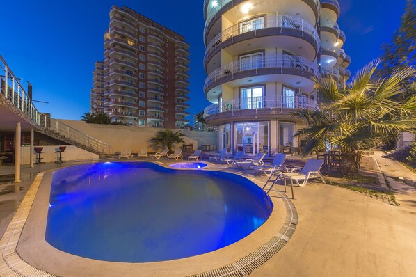 Seasonal outdoor pool, pool umbrellas, pool loungers