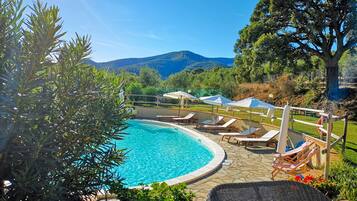 Seasonal outdoor pool, open 7:30 AM to 7:30 PM, pool umbrellas