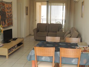 Exclusive Apartment, 1 Bedroom, Balcony, Poolside | Living area | 26-inch flat-screen TV with satellite channels, LCD TV