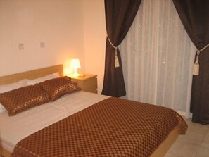 Exclusive Apartment, 1 Bedroom, Balcony, Poolside | 1 bedroom, in-room safe, individually furnished, blackout drapes