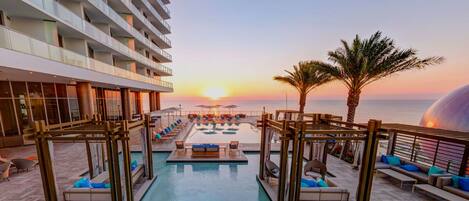 2 outdoor pools, open 10:00 AM to 8:00 PM, pool umbrellas, pool loungers