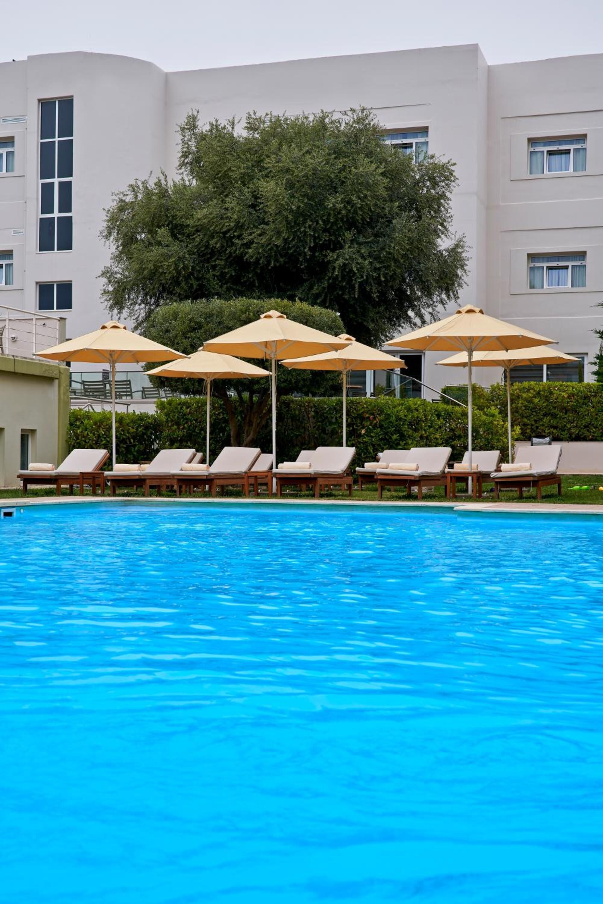 seasonal outdoor pool, open 11:00 am to 7:00 pm, pool umbrellas