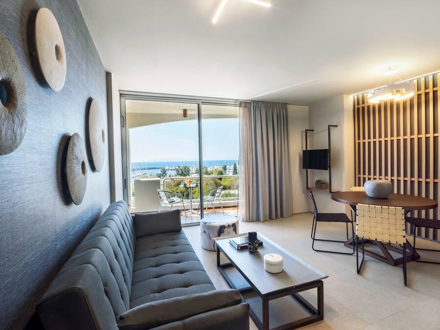 Premium Apartment, 1 Bedroom, Partial Sea View | Living area | 22-inch flat-screen TV with satellite channels, LCD TV