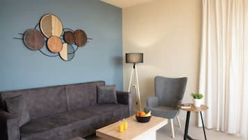 Standard Apartment, 2 Bedrooms, Sea View (Family) | Living area | 22-inch flat-screen TV with satellite channels, LCD TV