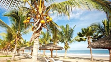 On the beach, sun loungers, beach umbrellas, beach towels
