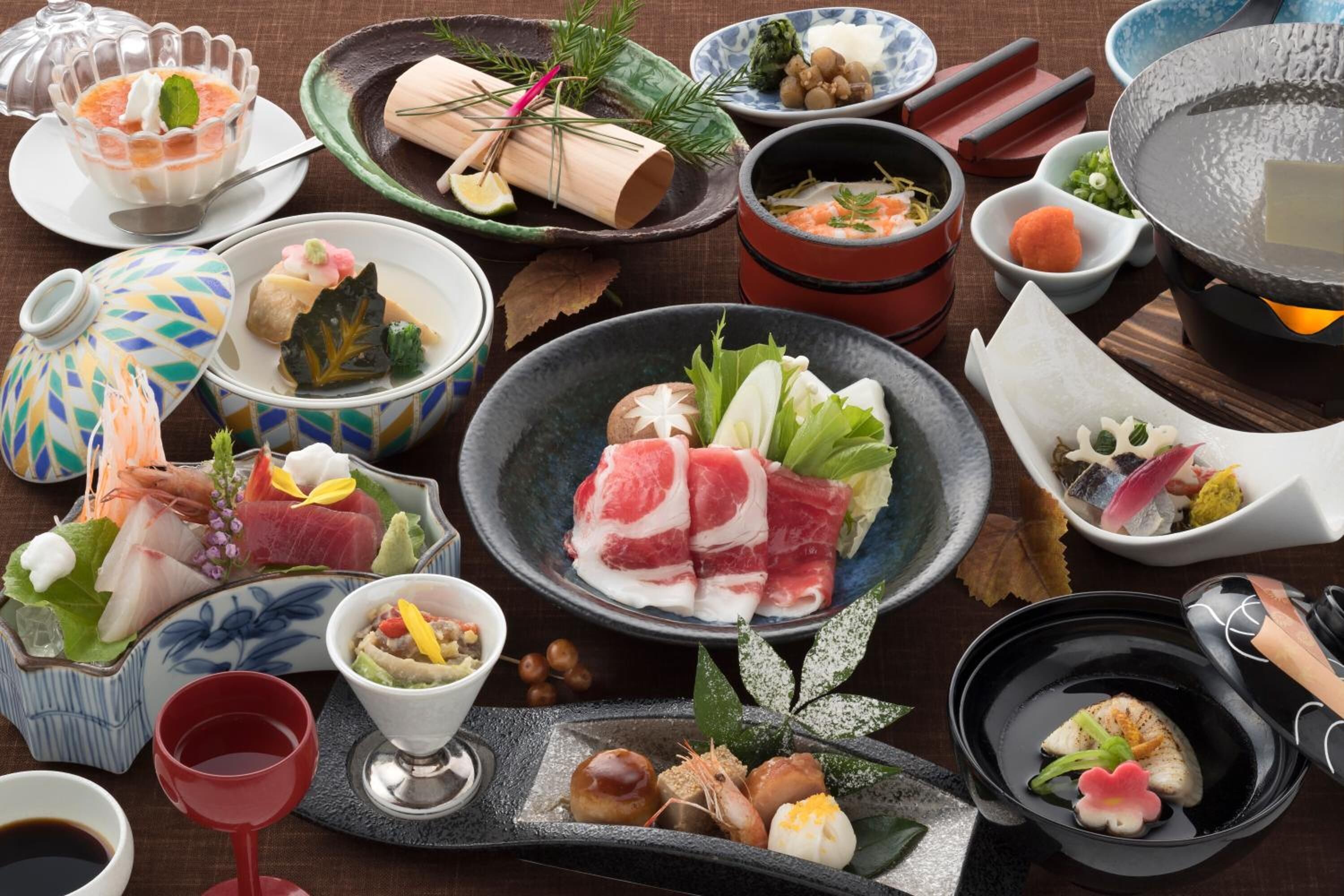 A variety of Japanese dishes and utensils on a table.
