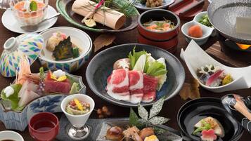 A variety of Japanese dishes and utensils on a table.