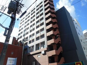 Stylish building with balconies and a modern design.