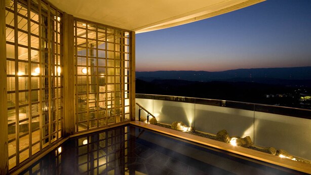 A balcony with a view of the cityscape at dusk. - Hotel Azalea (Tsu)